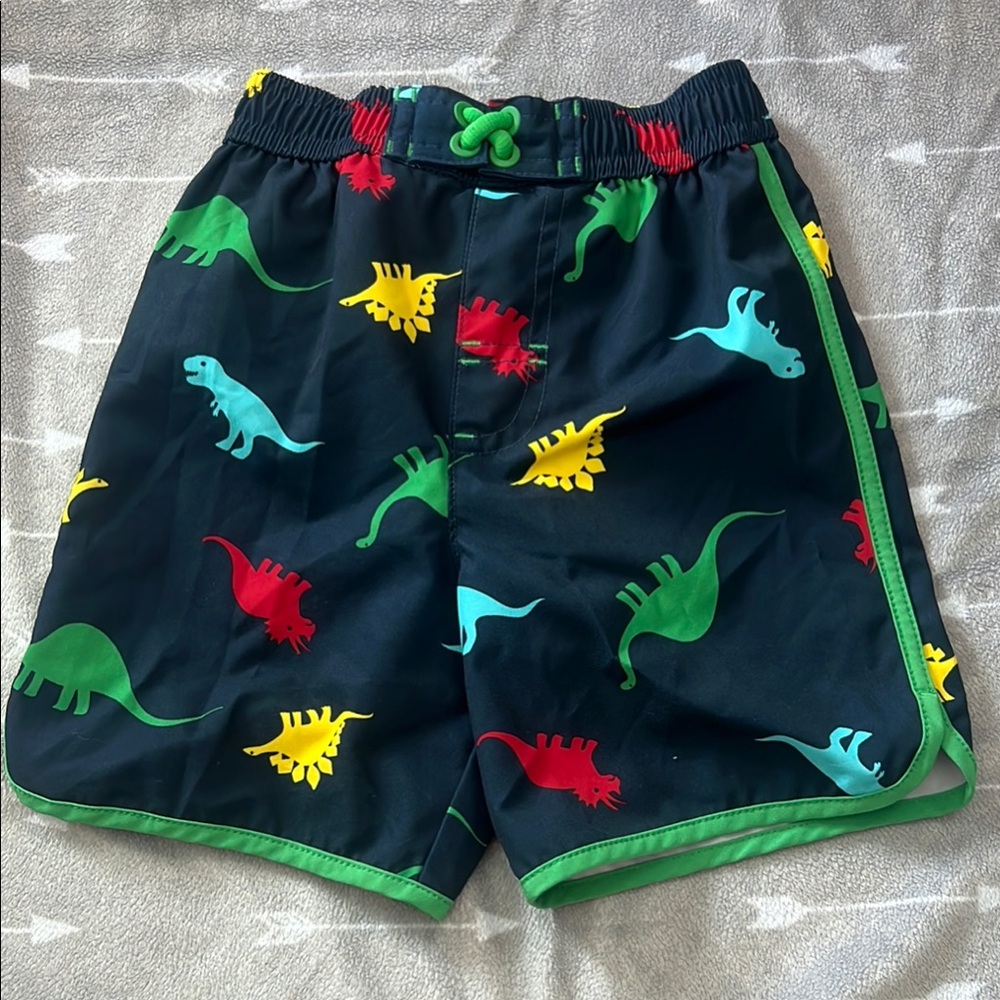 Navy blue swim shorts with dinosaur print